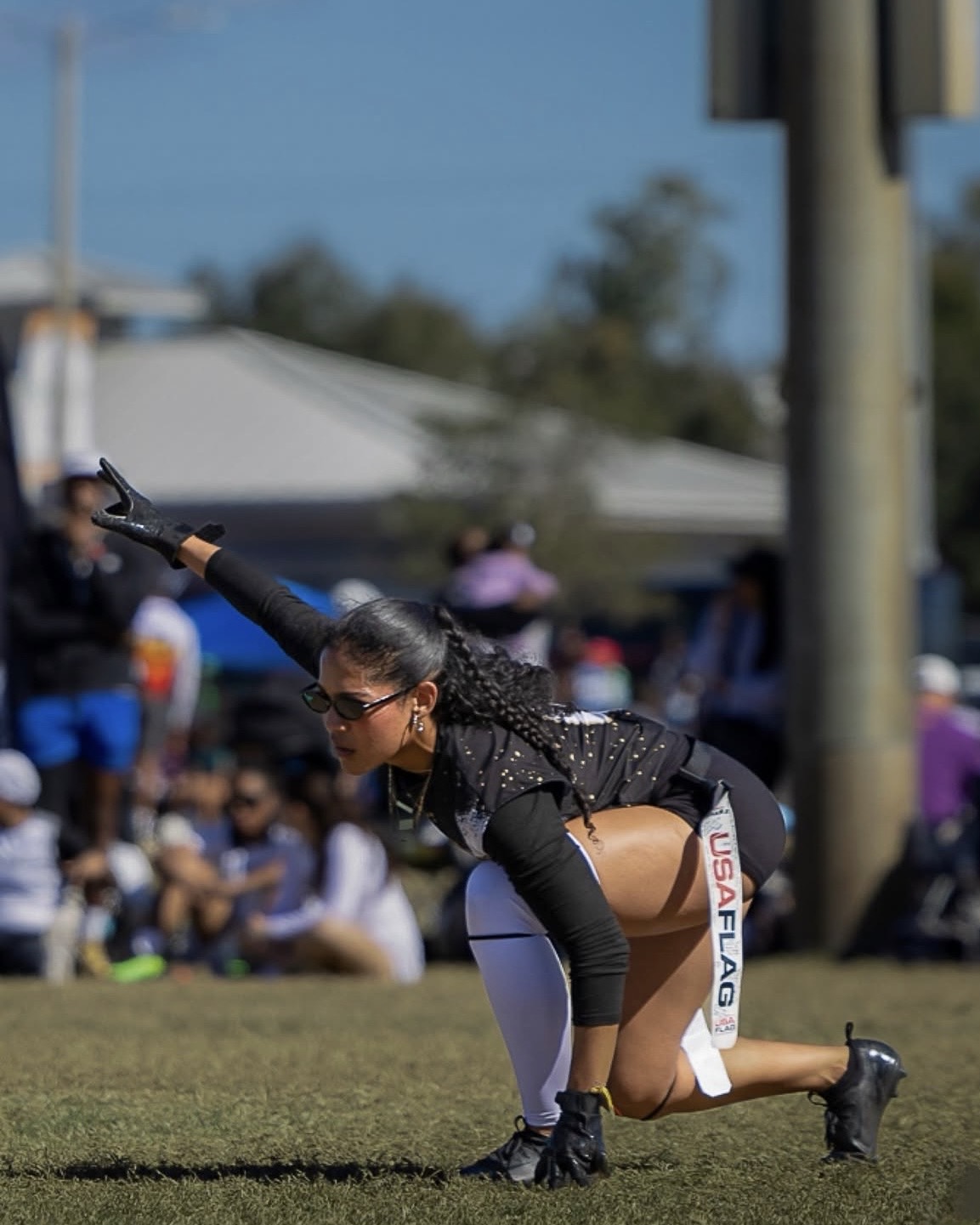 Coach Idalys Acosta in a defensive flag football stance