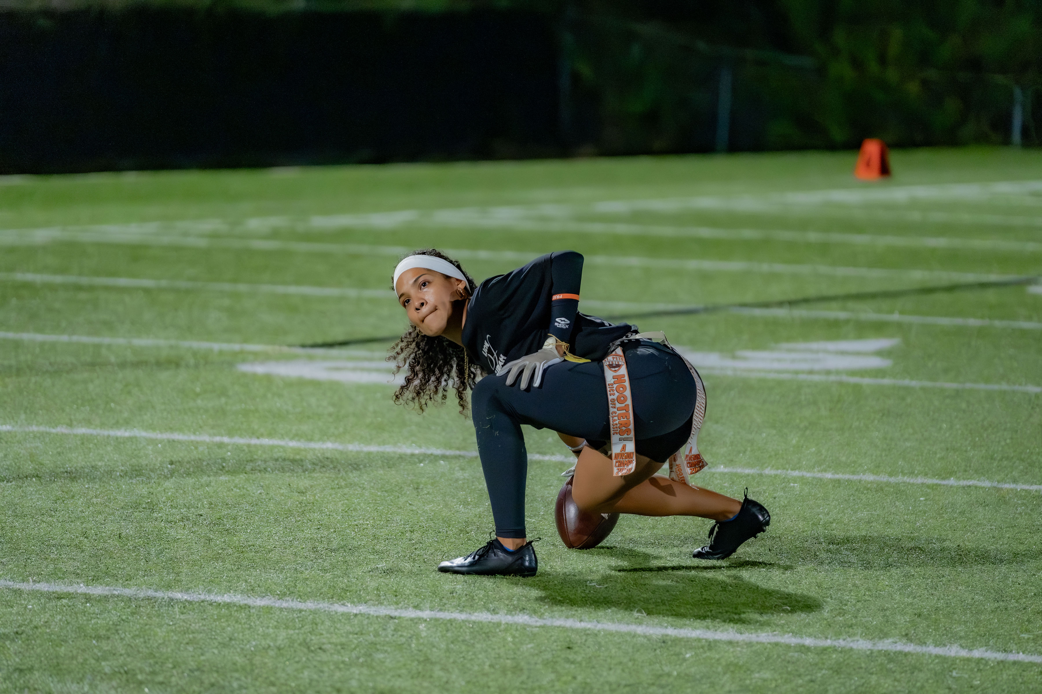 Flag football player preparing for a snap